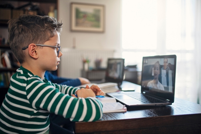 kid looking at a screen